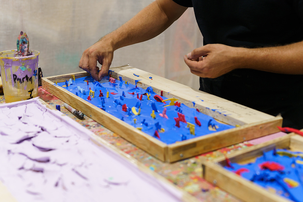 Beltrán Inserting Objects in His Poured Paint